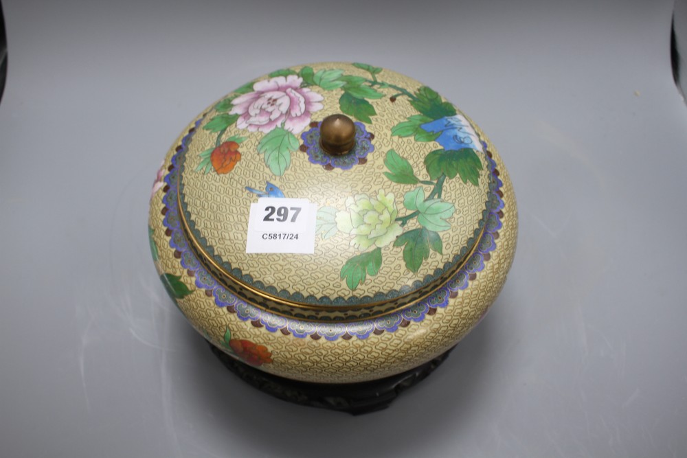 A Chinese cloisonne bowl and cover, decorated with flowers, on ebonised stand, diameter 26cm, overall height 21cm